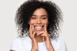 Other Services - woman flossing her teeth